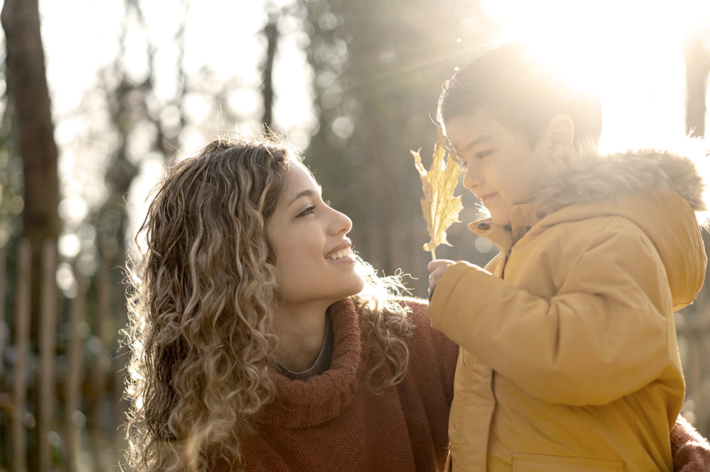 A woman and a boy looking at each other