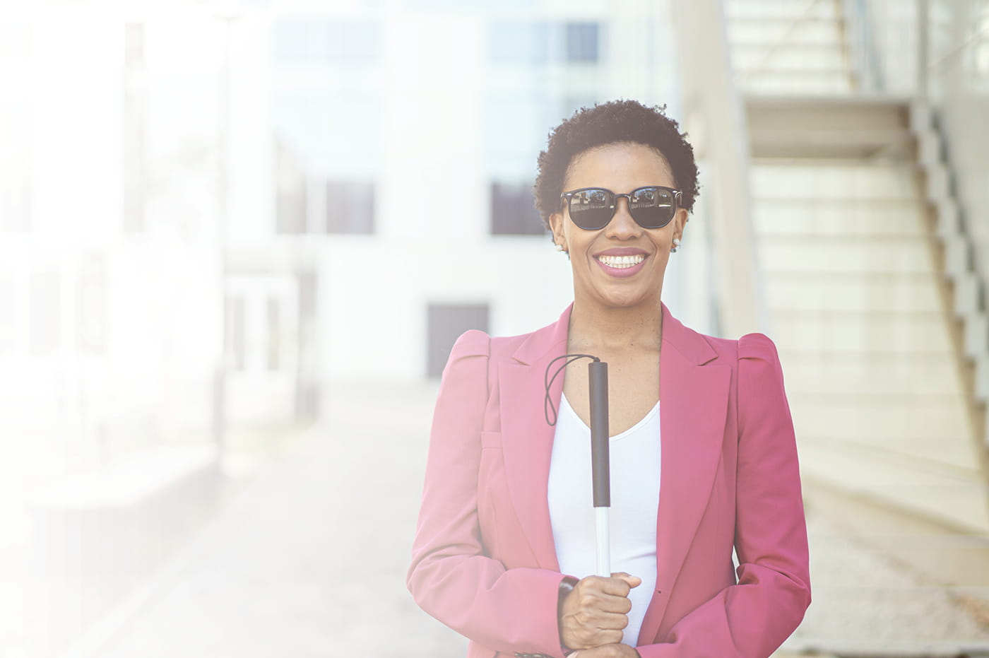 A woman who is blind smiling. 