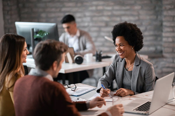 A financial advisor talking with her clients.