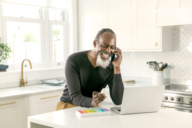 A man on the phone to ask questions about his medication.