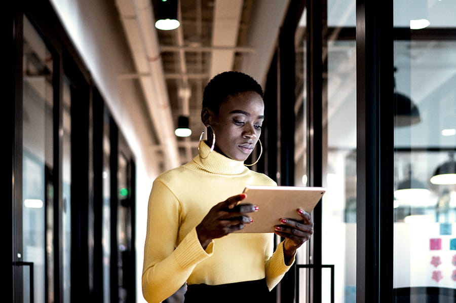 A woman looking at a tablet device