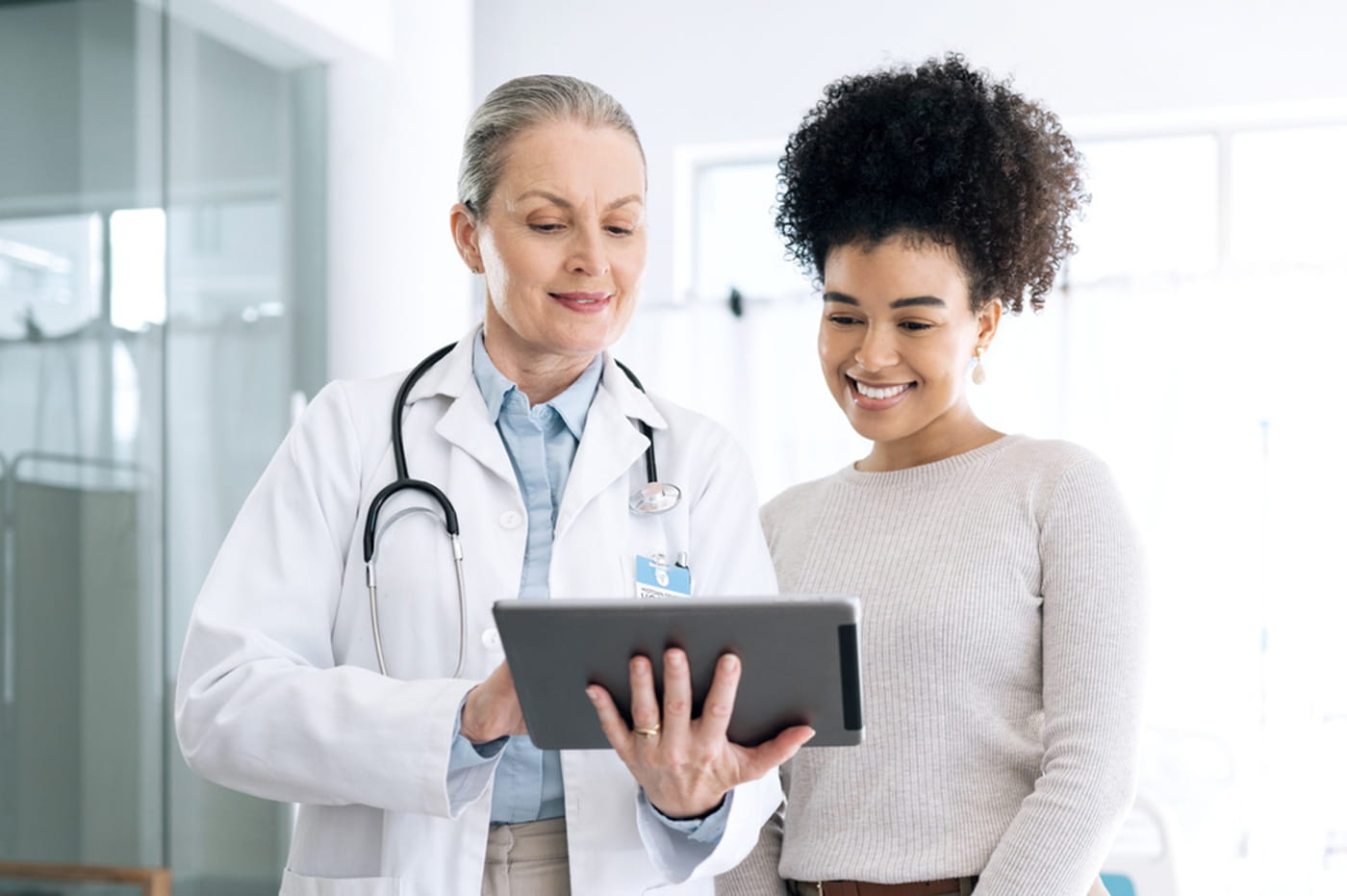 Doctor and Patient looking at a tablet