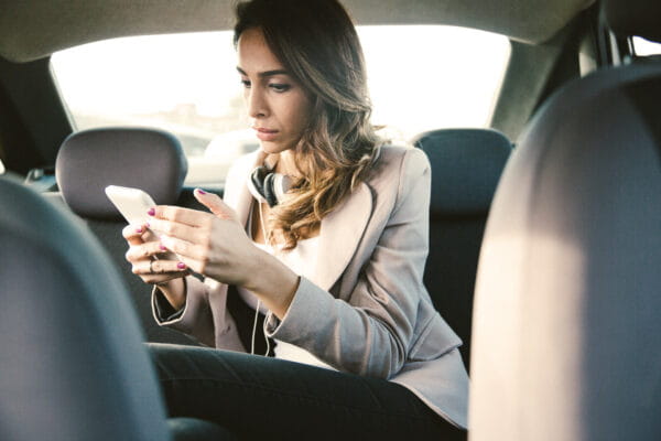 Woman on a cellphone in a car