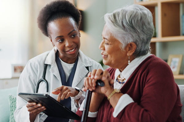 A doctor consulting an older patient.