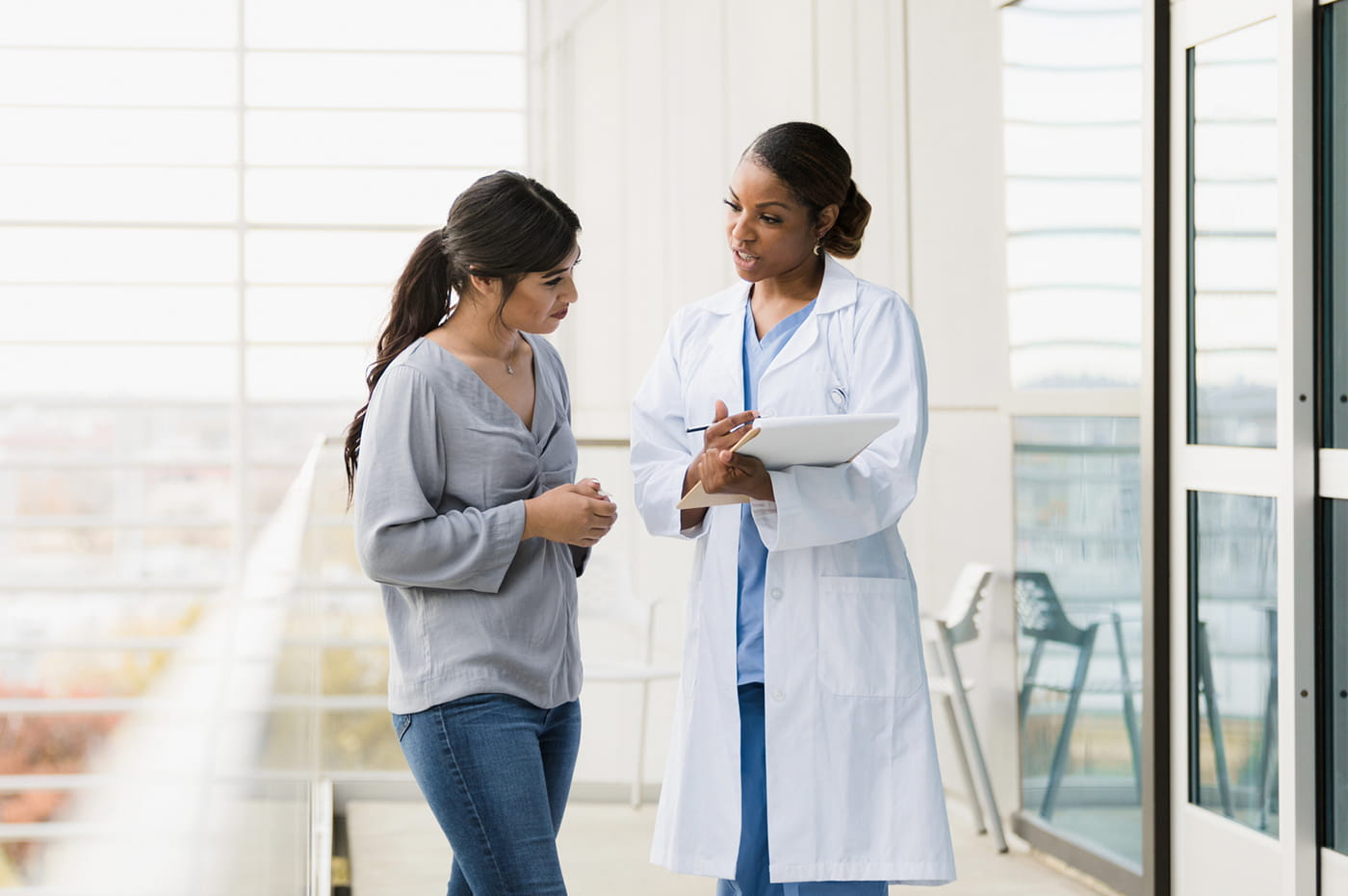 A woman talking to her doctor.