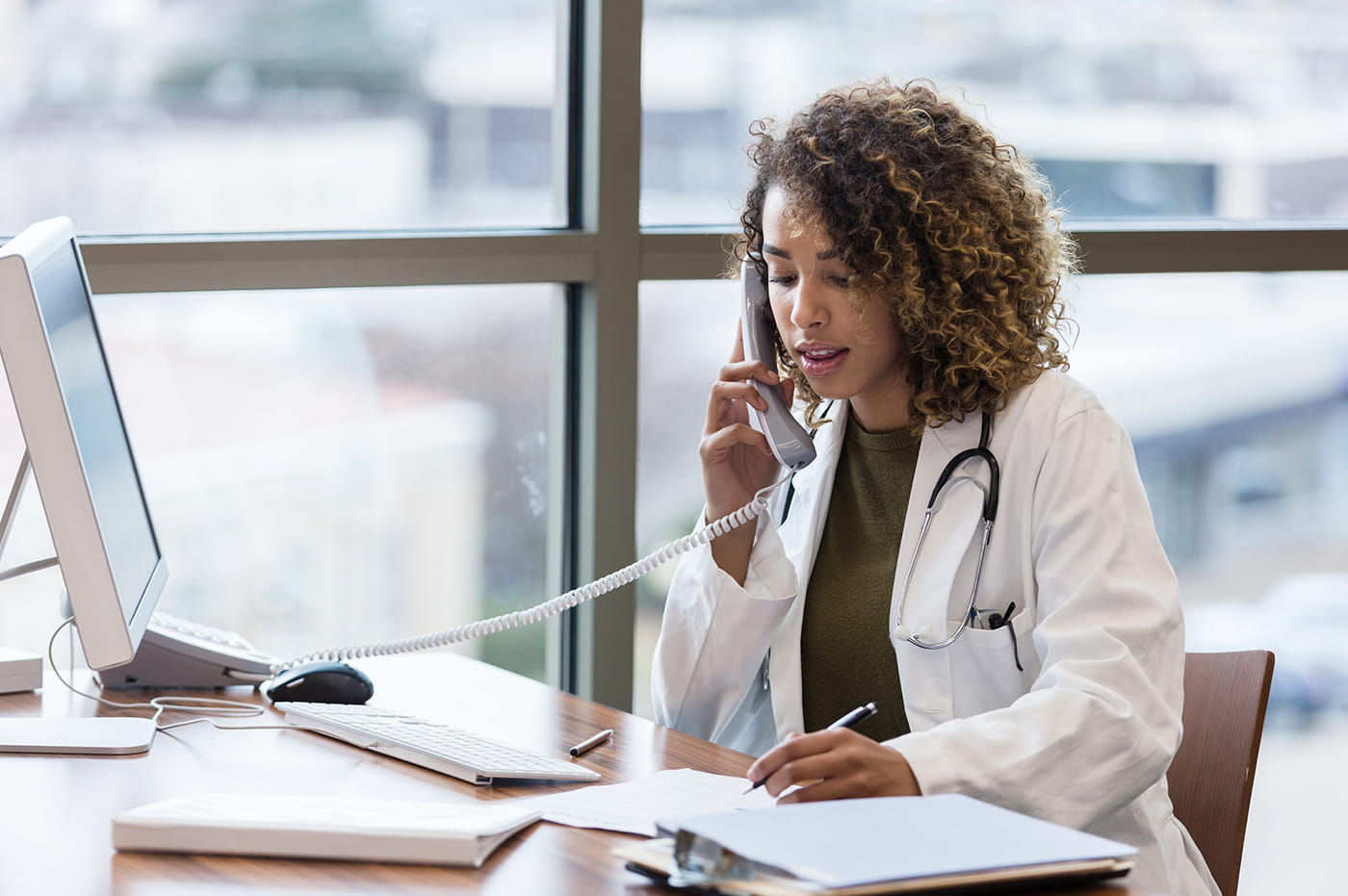 A doctor talking on the phone.