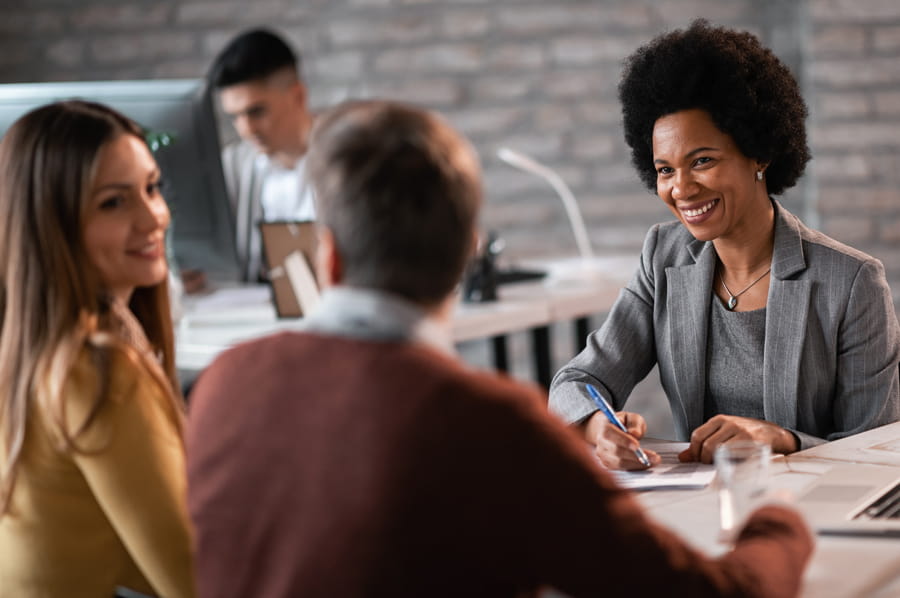 Two woman and a man in a business meeting 